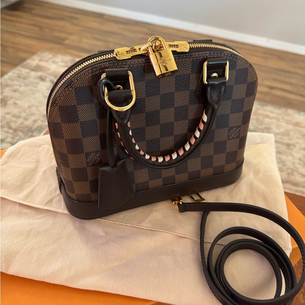 Louis Vuitton Alma BB in Damier Ebene.